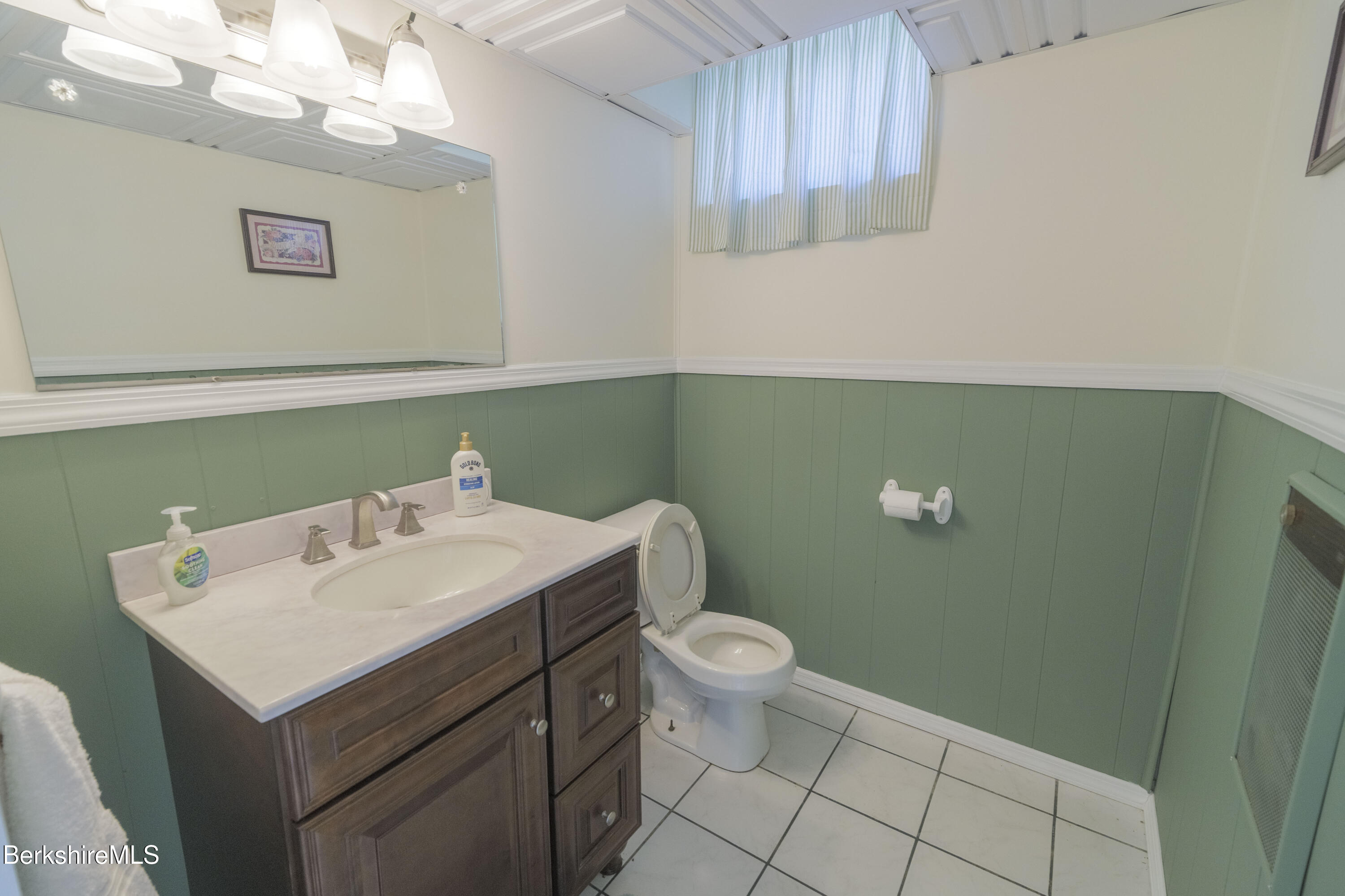 582 East New Lenox Road Pittsfield, MA 01201 - Photo 20 of 23 a bathroom with a sink toilet and mirror