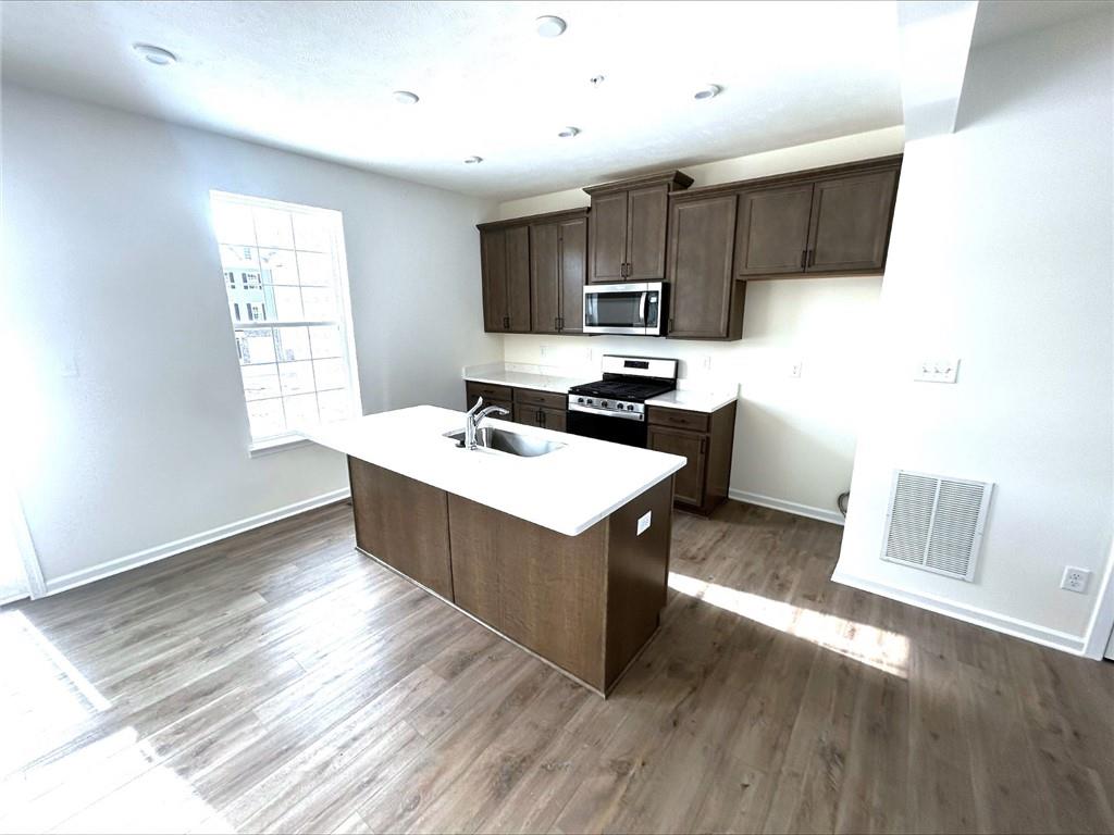 131 Affinity Drive Harmony, PA 16037 - Photo 3 of 12 a kitchen with a sink a counter top space and appliances