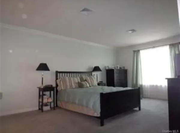a bed room with furniture and a window