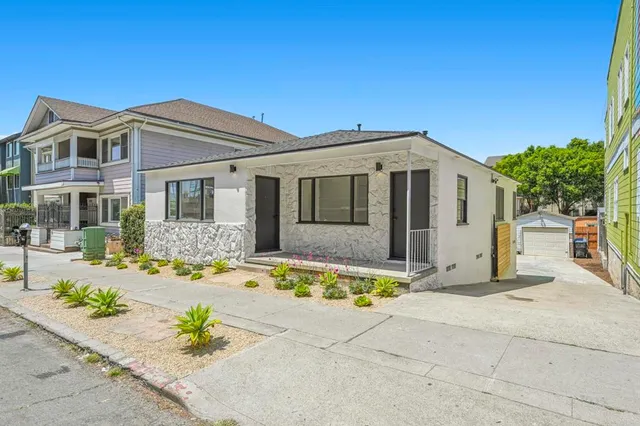 a front view of a house with a outdoor space