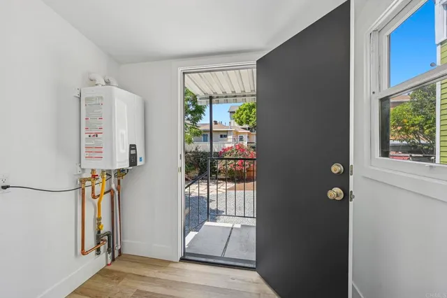 a view of hallway with furniture and a window