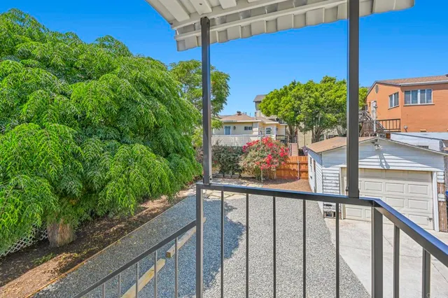 a view of a balcony with an outdoor seating