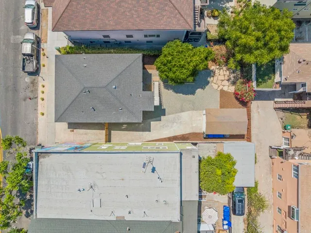 an aerial view of residential houses with outdoor space