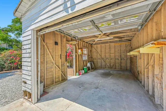 a view of a garage with an outdoor space