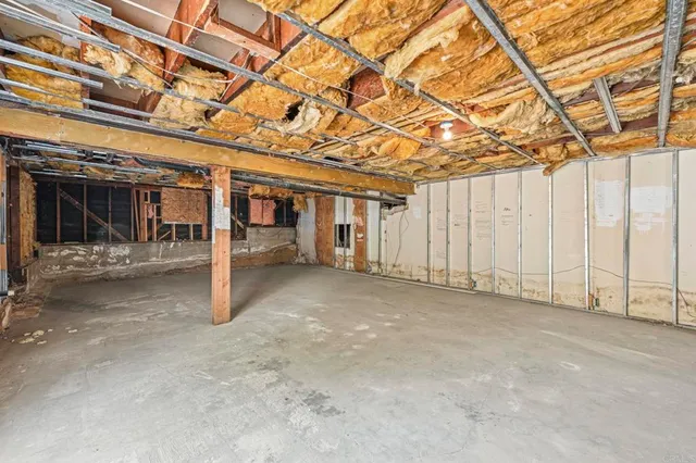 a view of a room with wooden walls