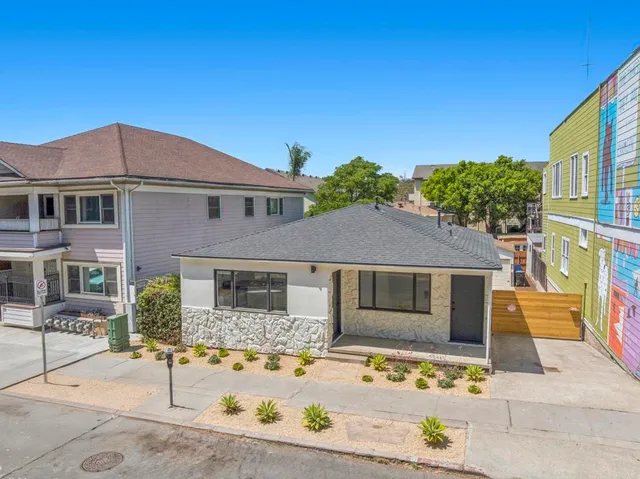 an aerial view of residential houses with outdoor space