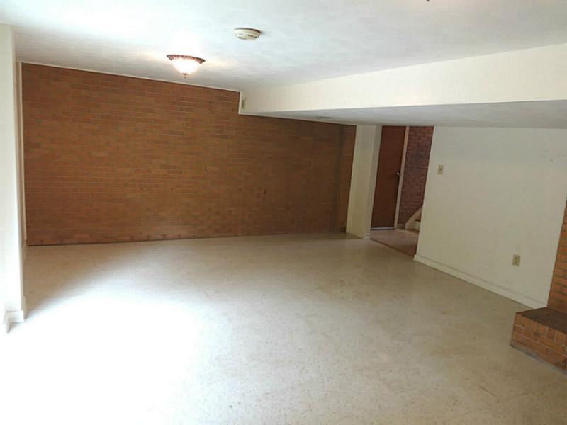 219 Lytton Road Coraopolis, PA 15108 - Photo 18 of 25 Basement/Game Room. Finished Game Room With Powder Room, Fireplace, Laundry/Utility Area.