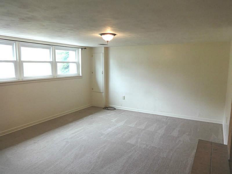 219 Lytton Road Coraopolis, PA 15108 - Photo 23 of 25 Family Room. This Would Be Great 5th Bedroom or A Guest Room! There Is Plenty Of Closet Space In This Room As Well.