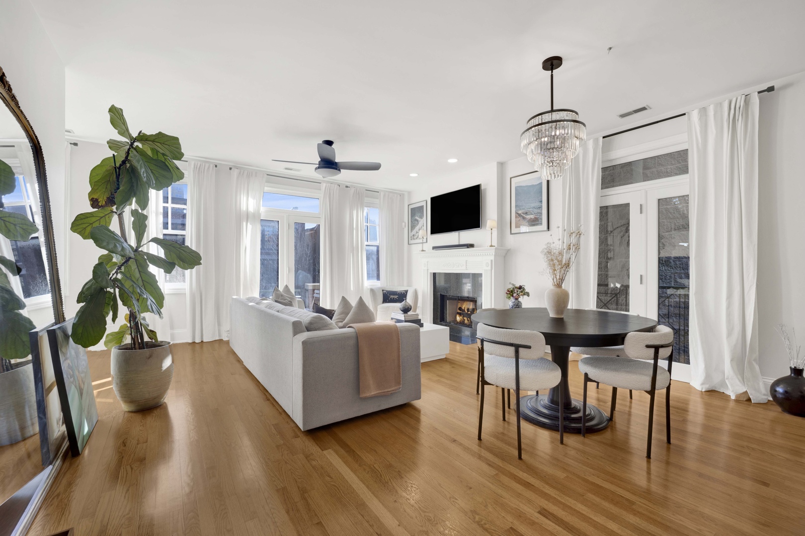 856 West Buckingham Place, Unit 3SW Chicago, IL 60657 - Photo 2 of 23 a living room with fireplace furniture and a wooden floor