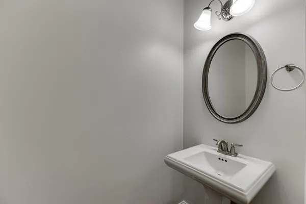 a bathroom with a double vanity sink a mirror and a shower
