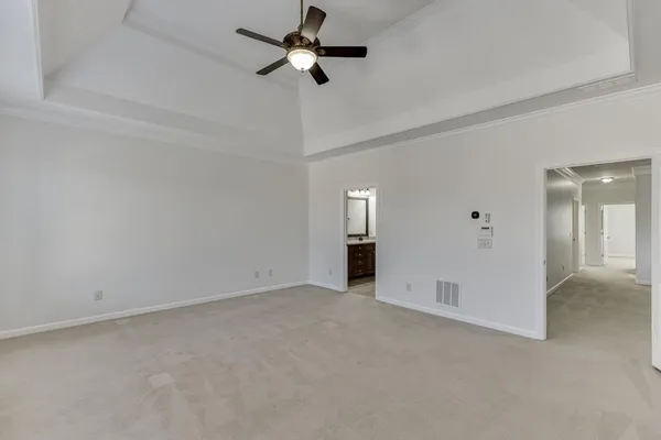 a view of an empty room and a window