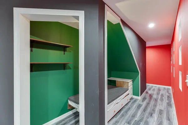 an aerial view of a house with a yard and lake view