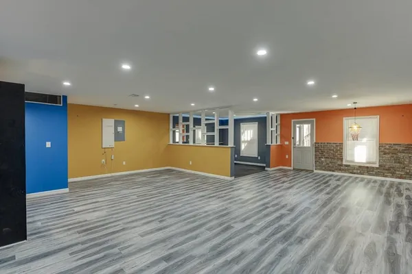 a view of a chairs and table on the terrace with a lake view