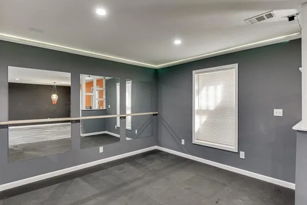 a front view of a house with a big yard