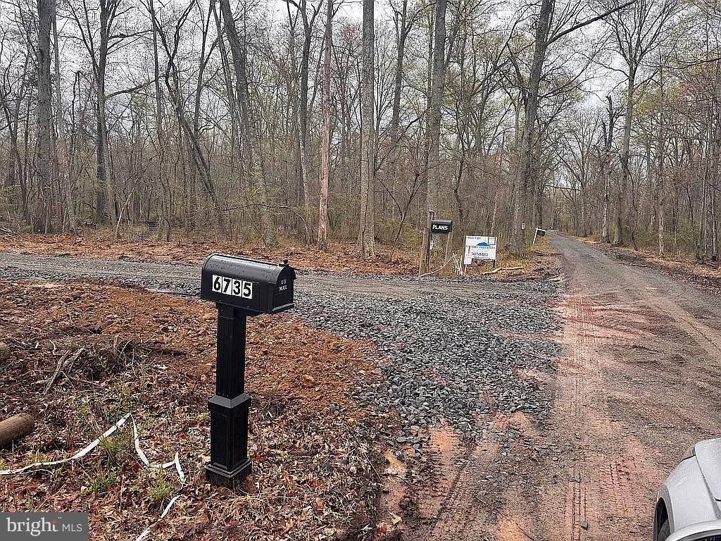6735 Beverly Road Broad Run, VA 20137 - Photo 6 of 31 a view of a fire pit in middle of the forest