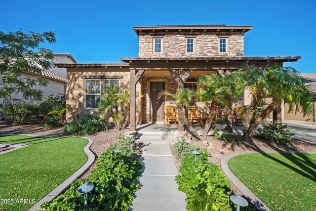 a front view of a house with garden