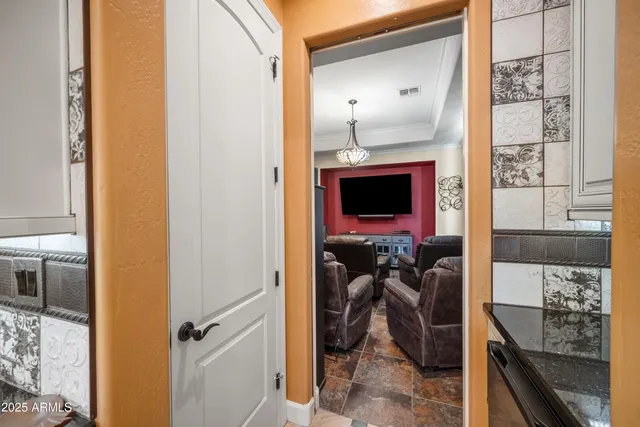 a view of a hallway with living room and furniture