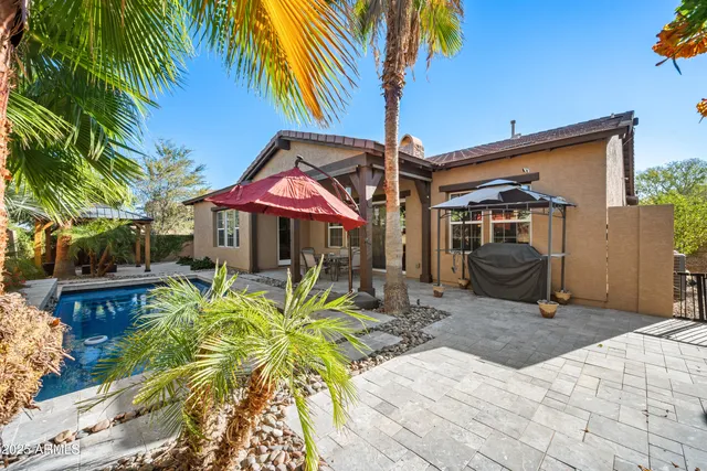 a view of a chair and tables in the patio