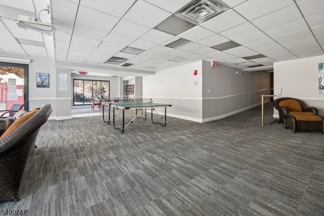 a view of a livingroom with furniture and window