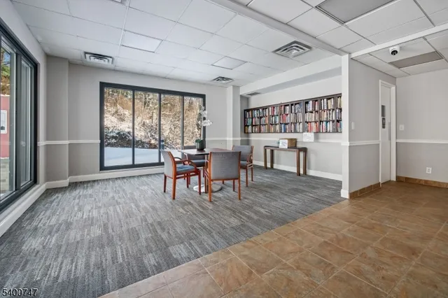 a view of a livingroom with furniture and window