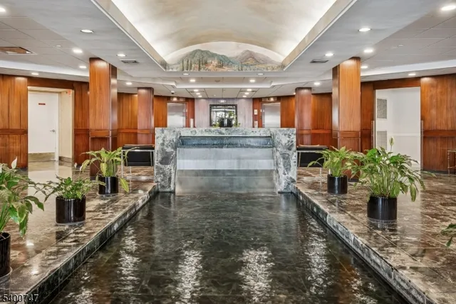 a view of a living room and kitchen