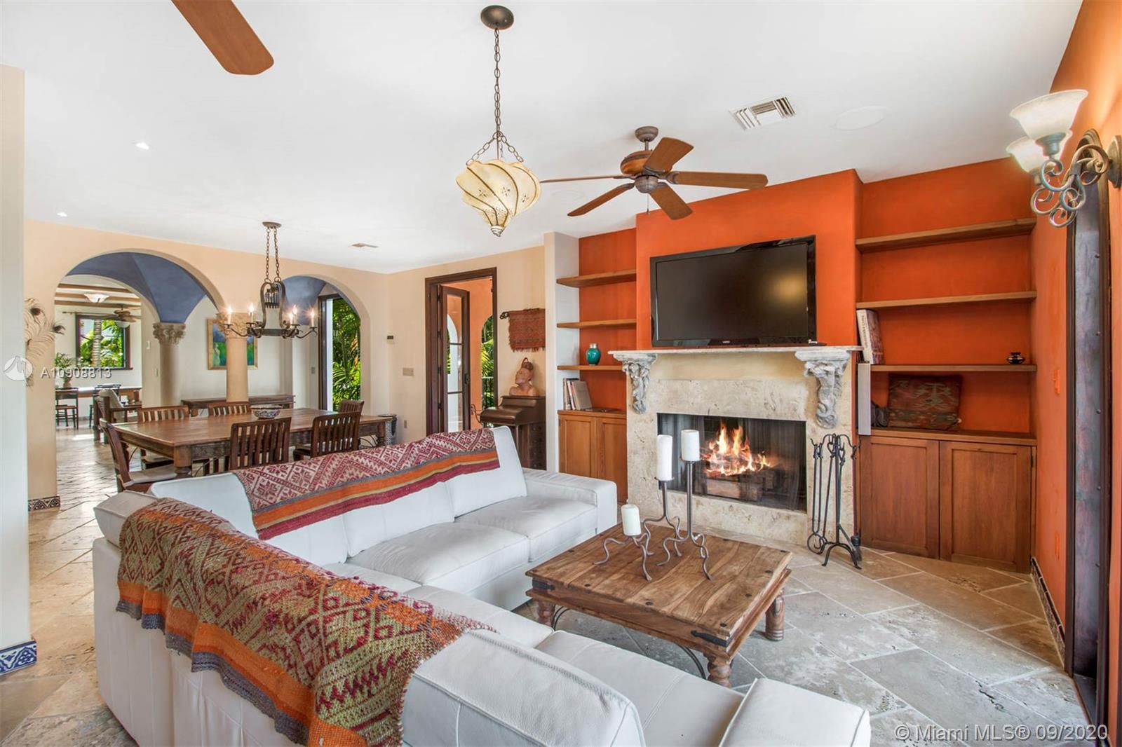 385 Ridgewood Road Key Biscayne, FL 33149 - Photo 12 of 54 a living room with fireplace furniture and a flat screen tv