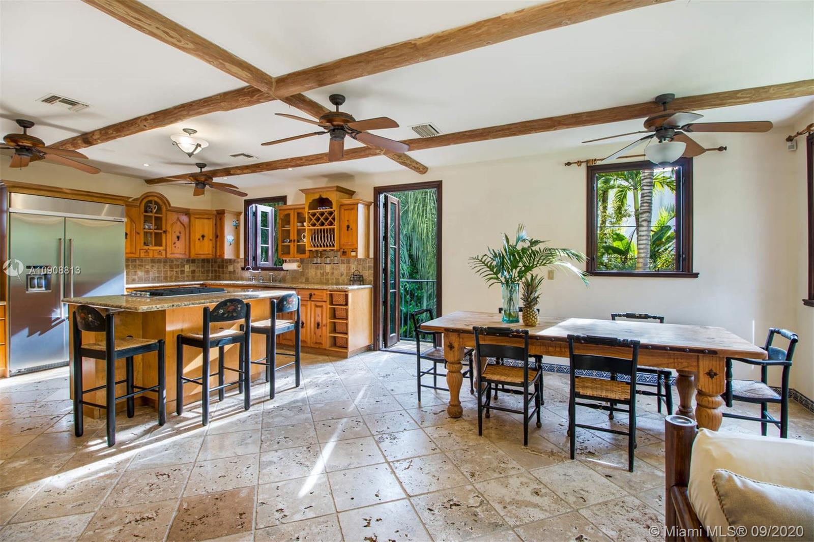 385 Ridgewood Road Key Biscayne, FL 33149 - Photo 15 of 54 a view of a dining room with furniture