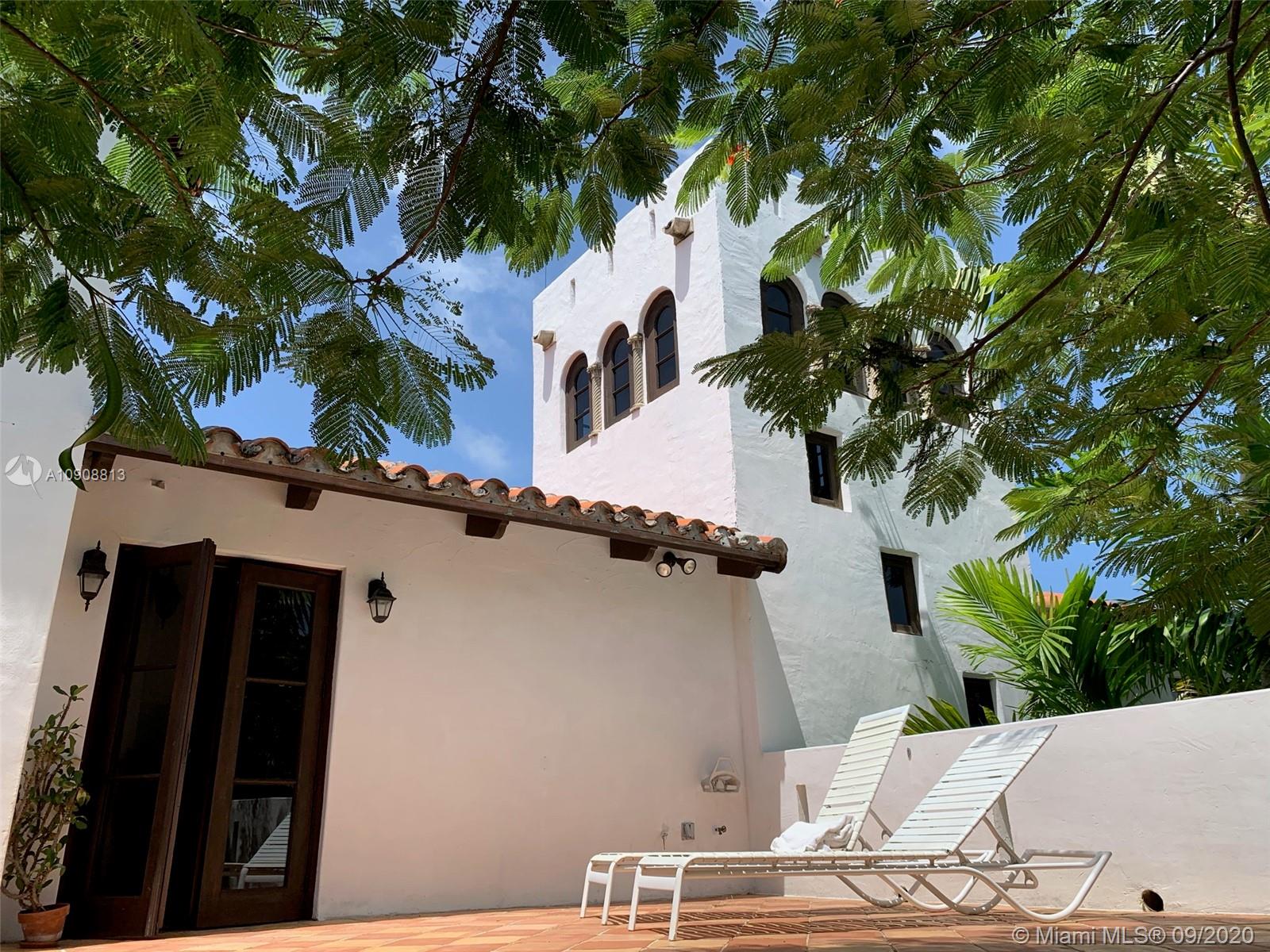 385 Ridgewood Road Key Biscayne, FL 33149 - Photo 29 of 54 a view of a house with a tree