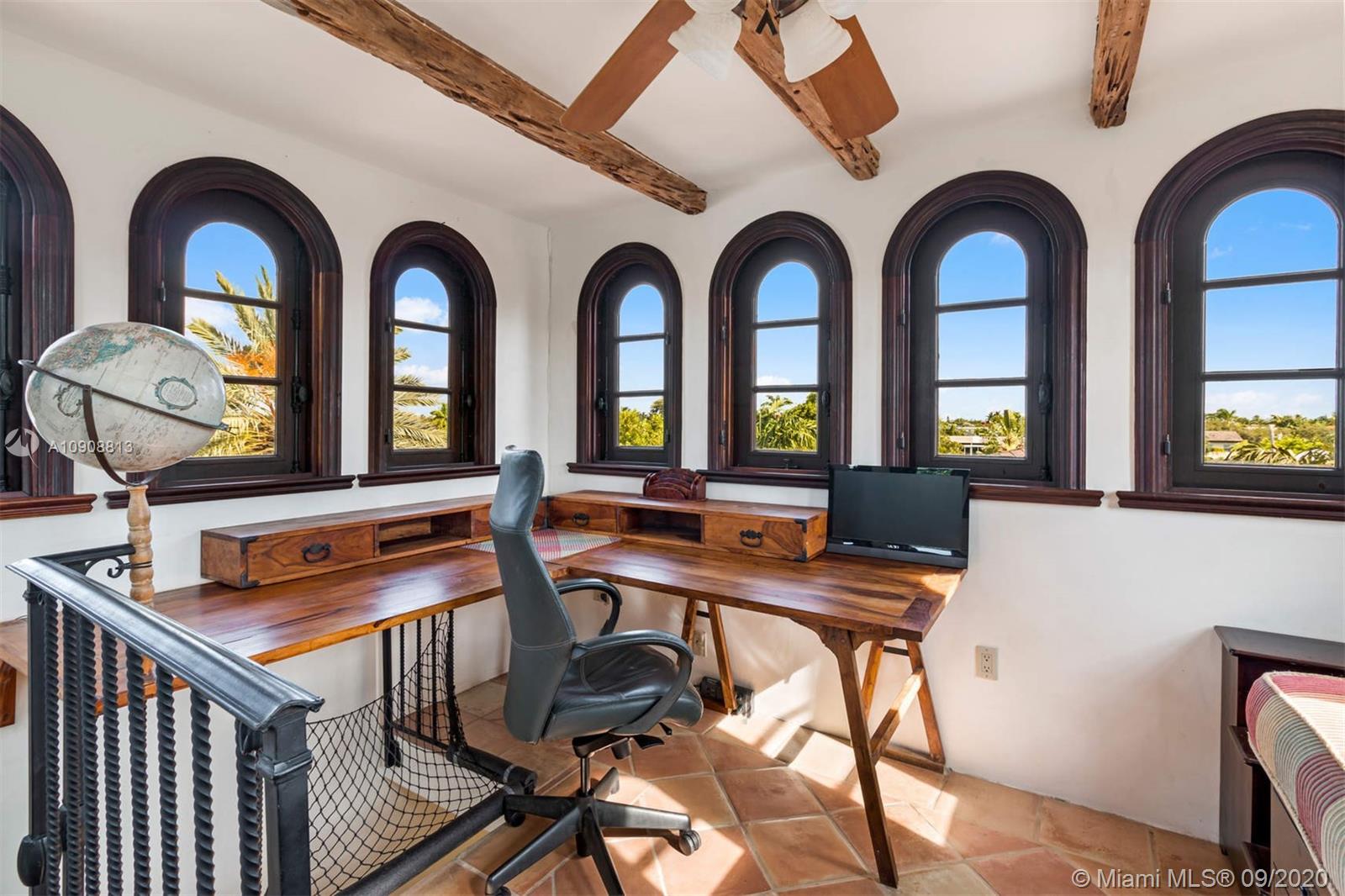 385 Ridgewood Road Key Biscayne, FL 33149 - Photo 36 of 54 a view of a balcony with furniture and a potted plant