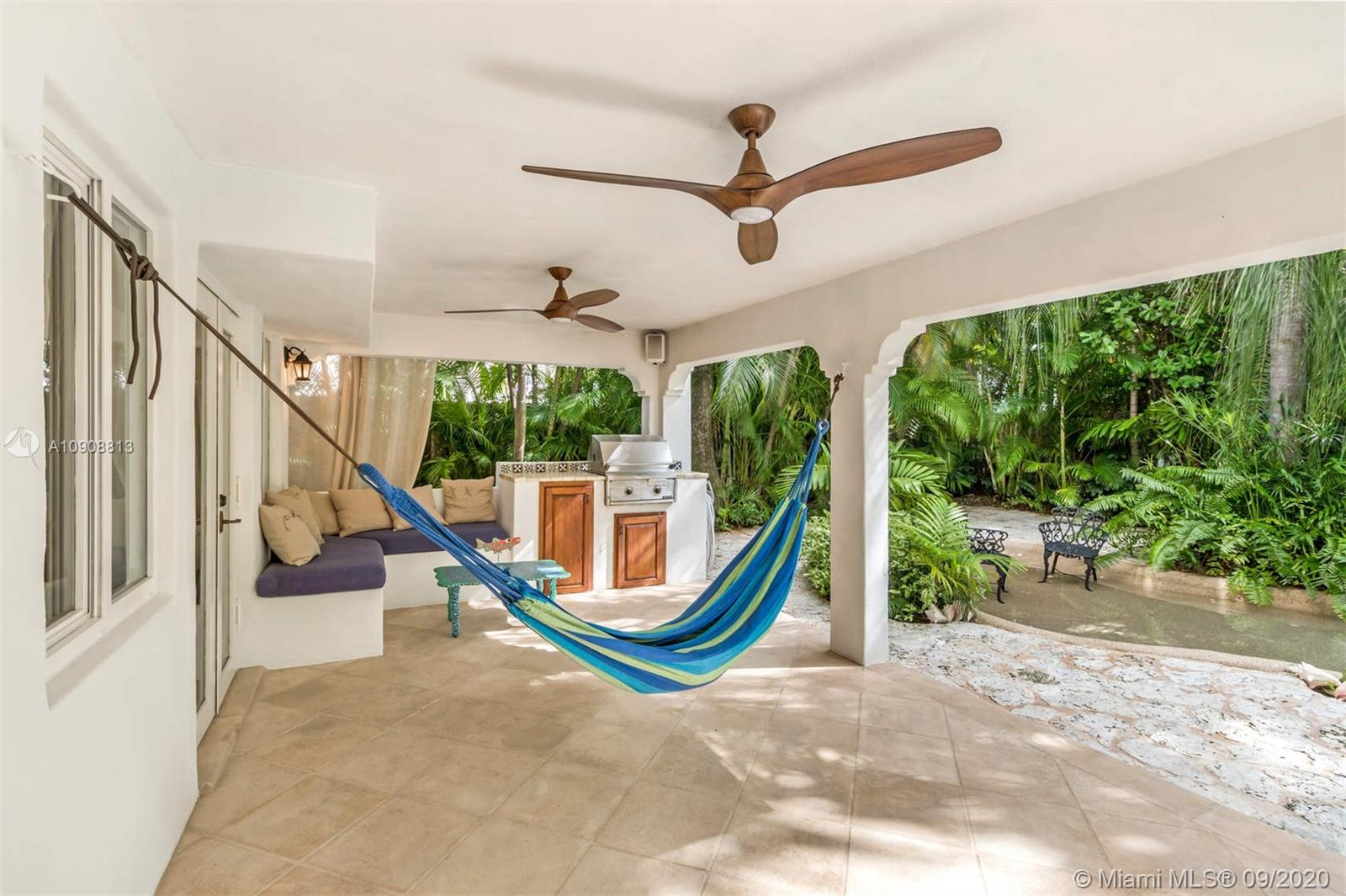 385 Ridgewood Road Key Biscayne, FL 33149 - Photo 42 of 54 a view of a bedroom with furniture and staircase
