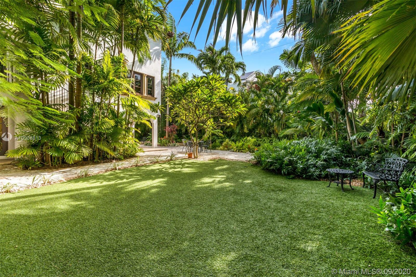 385 Ridgewood Road Key Biscayne, FL 33149 - Photo 44 of 54 a view of a yard with plants and large trees