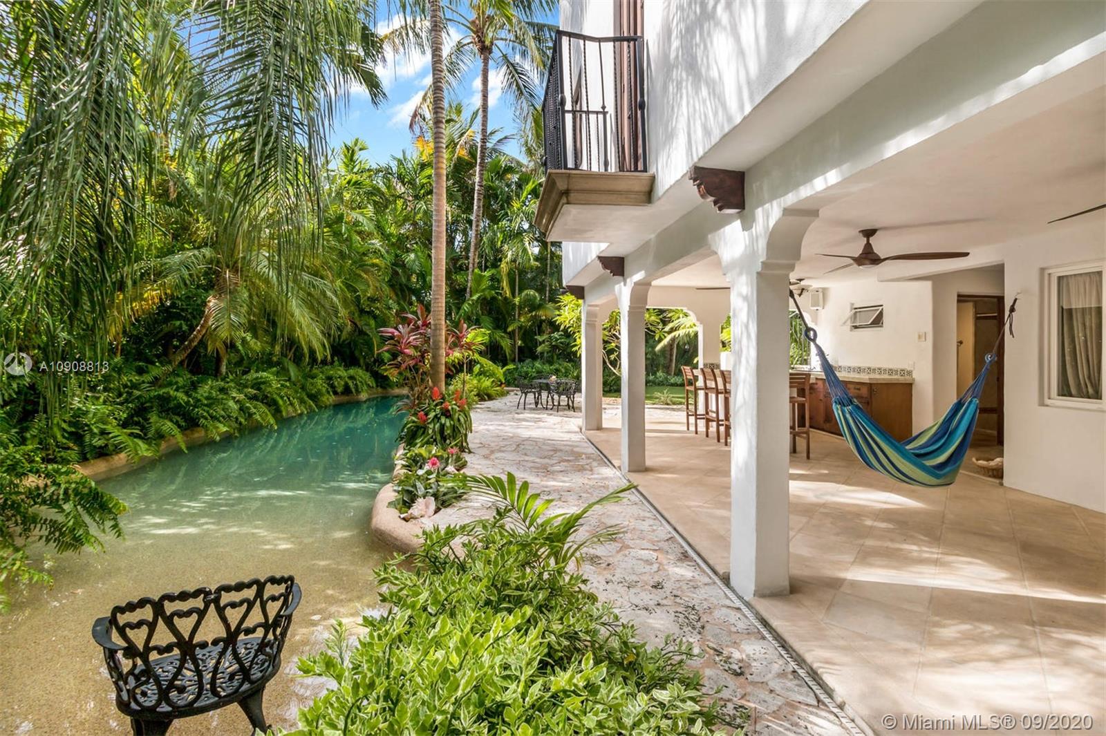 385 Ridgewood Road Key Biscayne, FL 33149 - Photo 48 of 54 a view of a hallway with flower plants