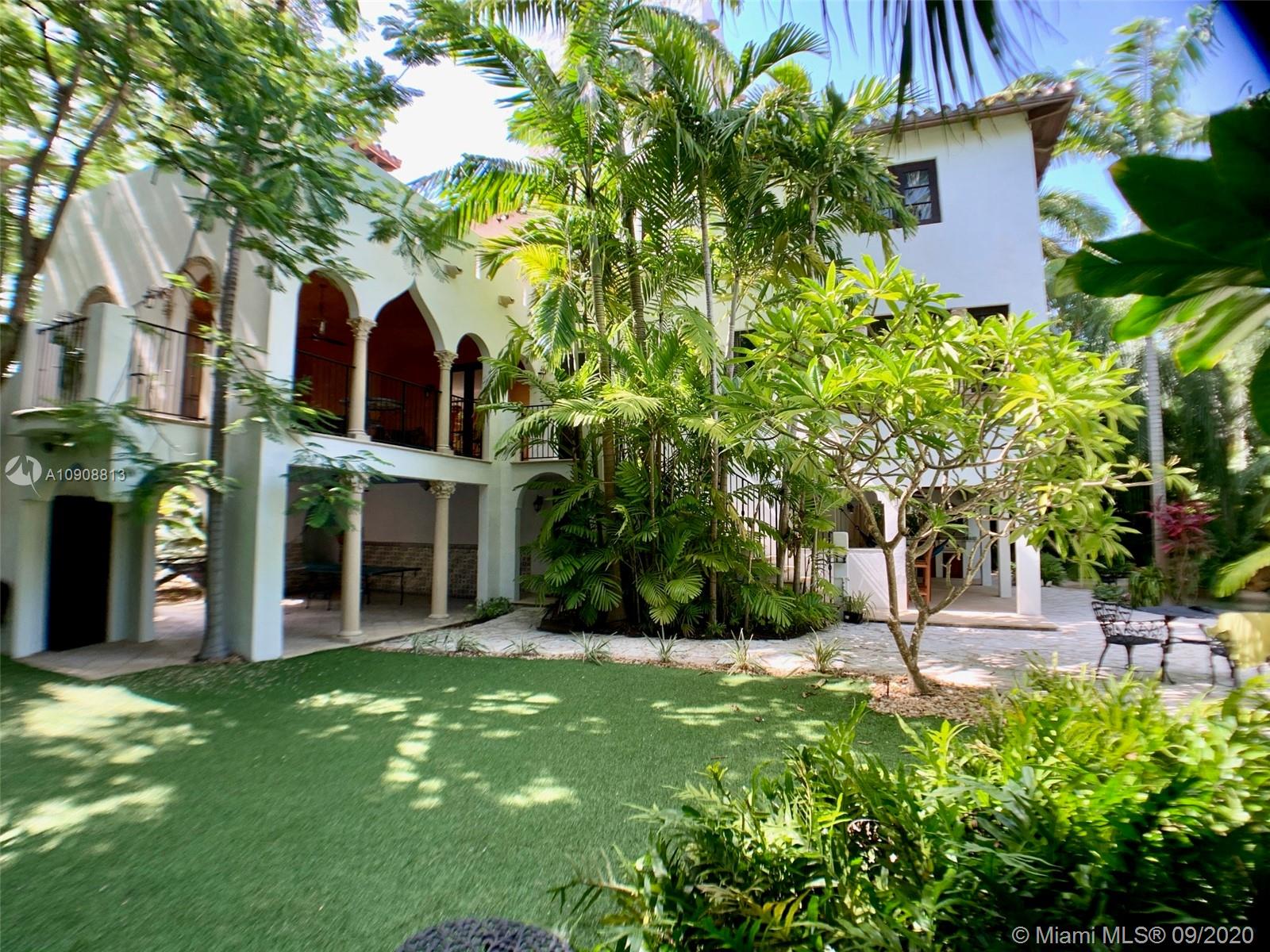385 Ridgewood Road Key Biscayne, FL 33149 - Photo 52 of 54 a view of a house with a yard and plants