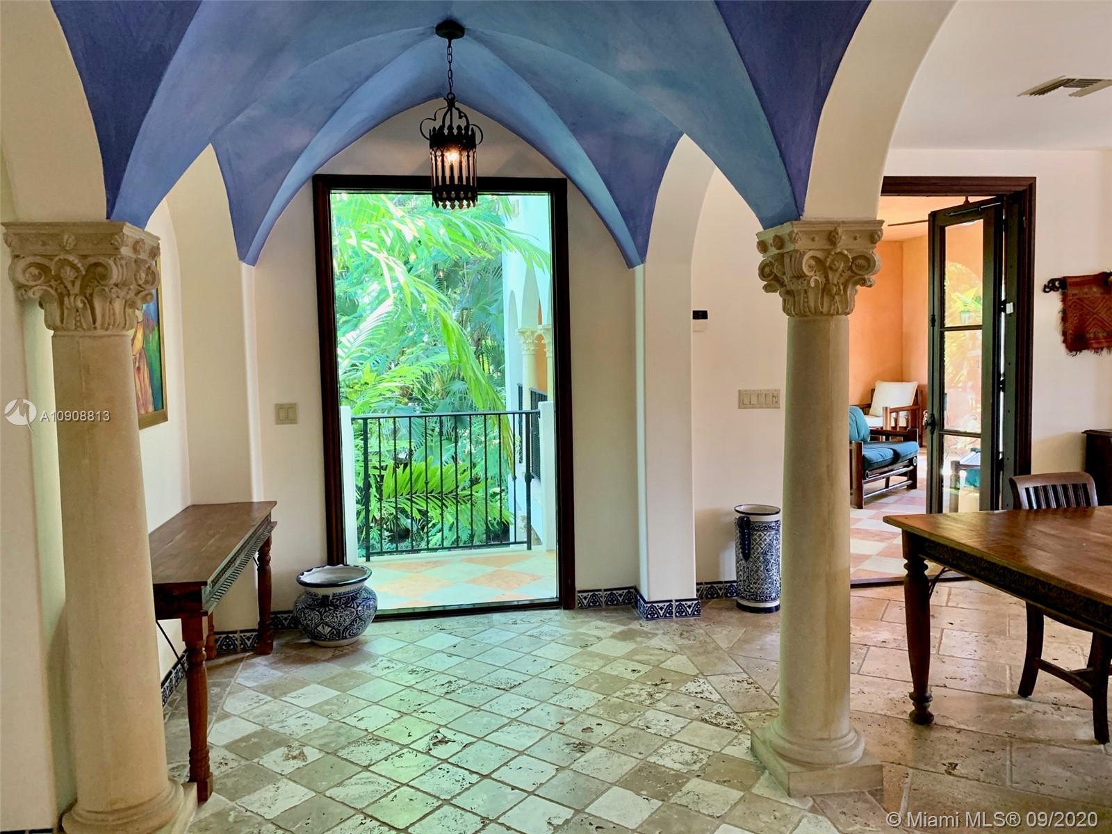 385 Ridgewood Road Key Biscayne, FL 33149 - Photo 10 of 54 a view of an entryway with furniture and floor to ceiling window