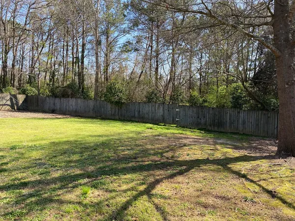 a swimming pool with wooden fence