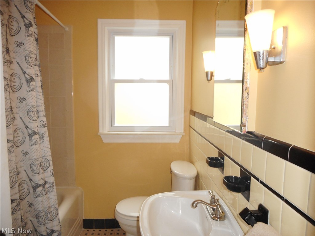 1150 Castleton Road Cleveland Heights, OH 44121 - Photo 10 of 25 This first floor bathroom has recently been updated with shower tile, new sink, toilet and fixtures.