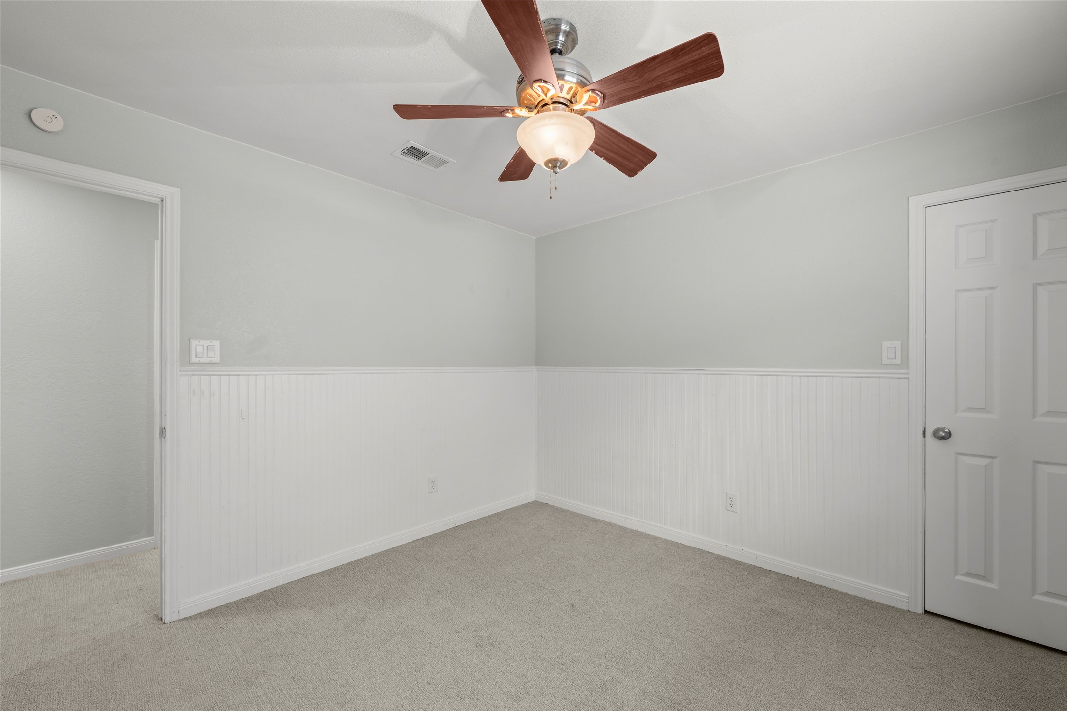1329 Quail Ravine Round Rock, TX 78664 - Photo 23 of 39 Classic wainscoting and wall-to-wall carpeting define this comfortable secondary space.