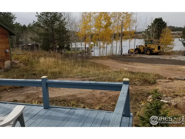 a view of swimming pool with a yard