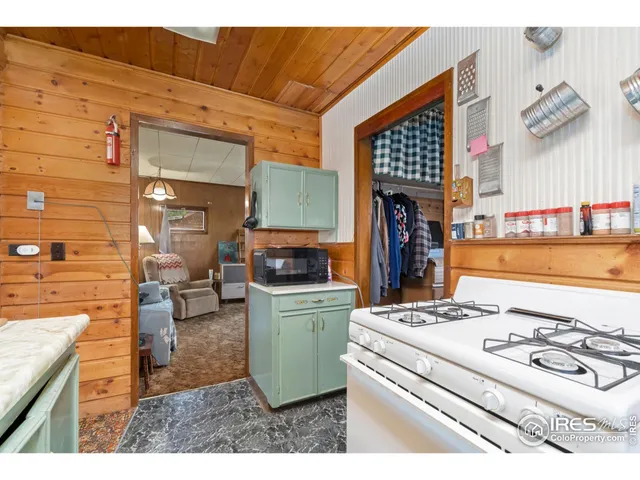 a view of living room with furniture and a window