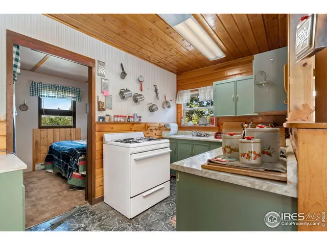 a kitchen with a sink and a stove top oven