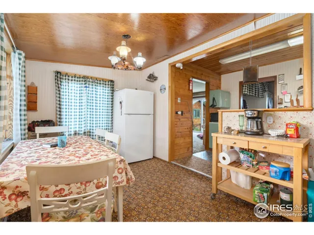 a bedroom with a bed and ceiling fan