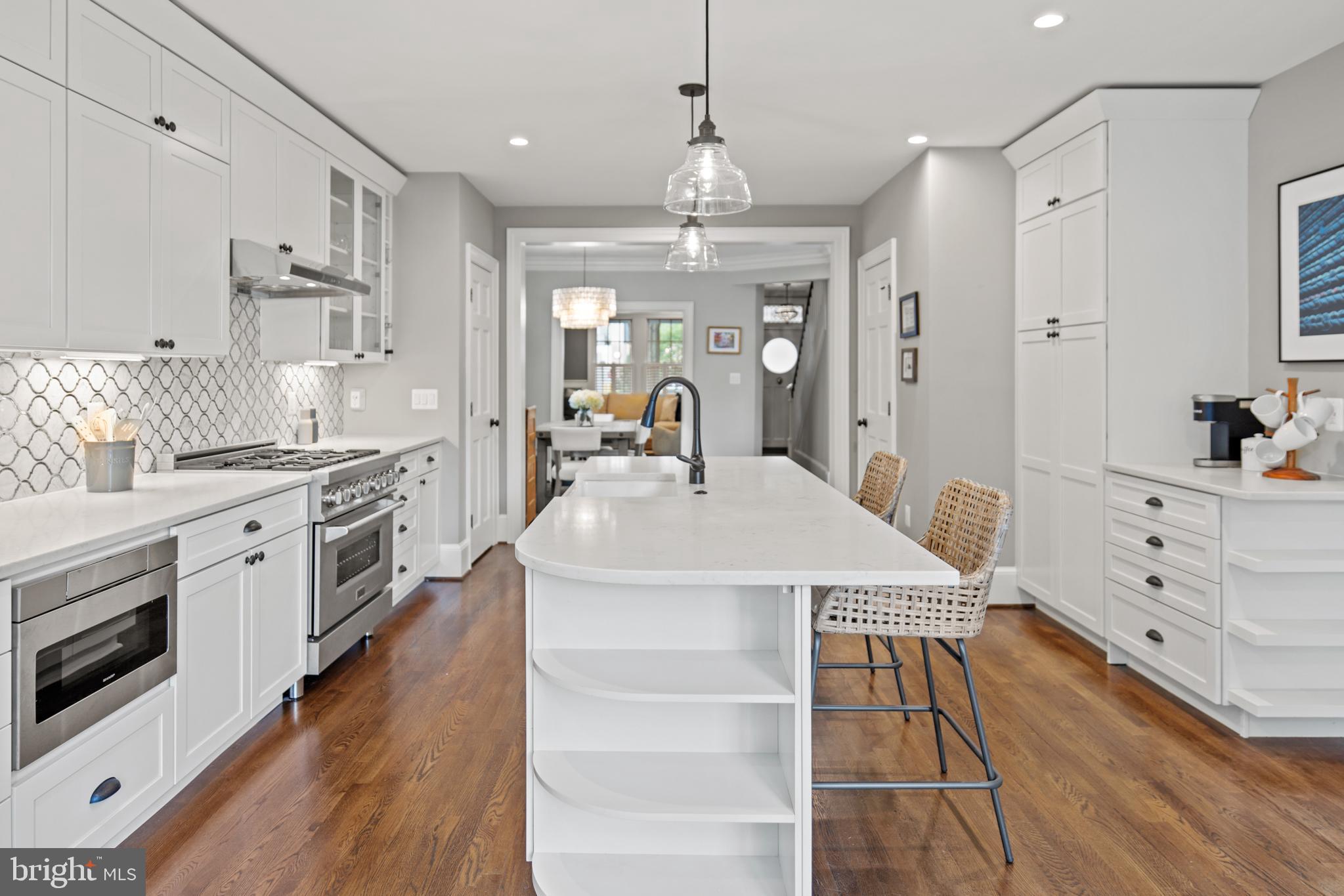 5212 MacArthur Boulevard Northwest Washington, DC 20016 - Photo 11 of 59 a kitchen with stainless steel appliances a white stove top oven and sink