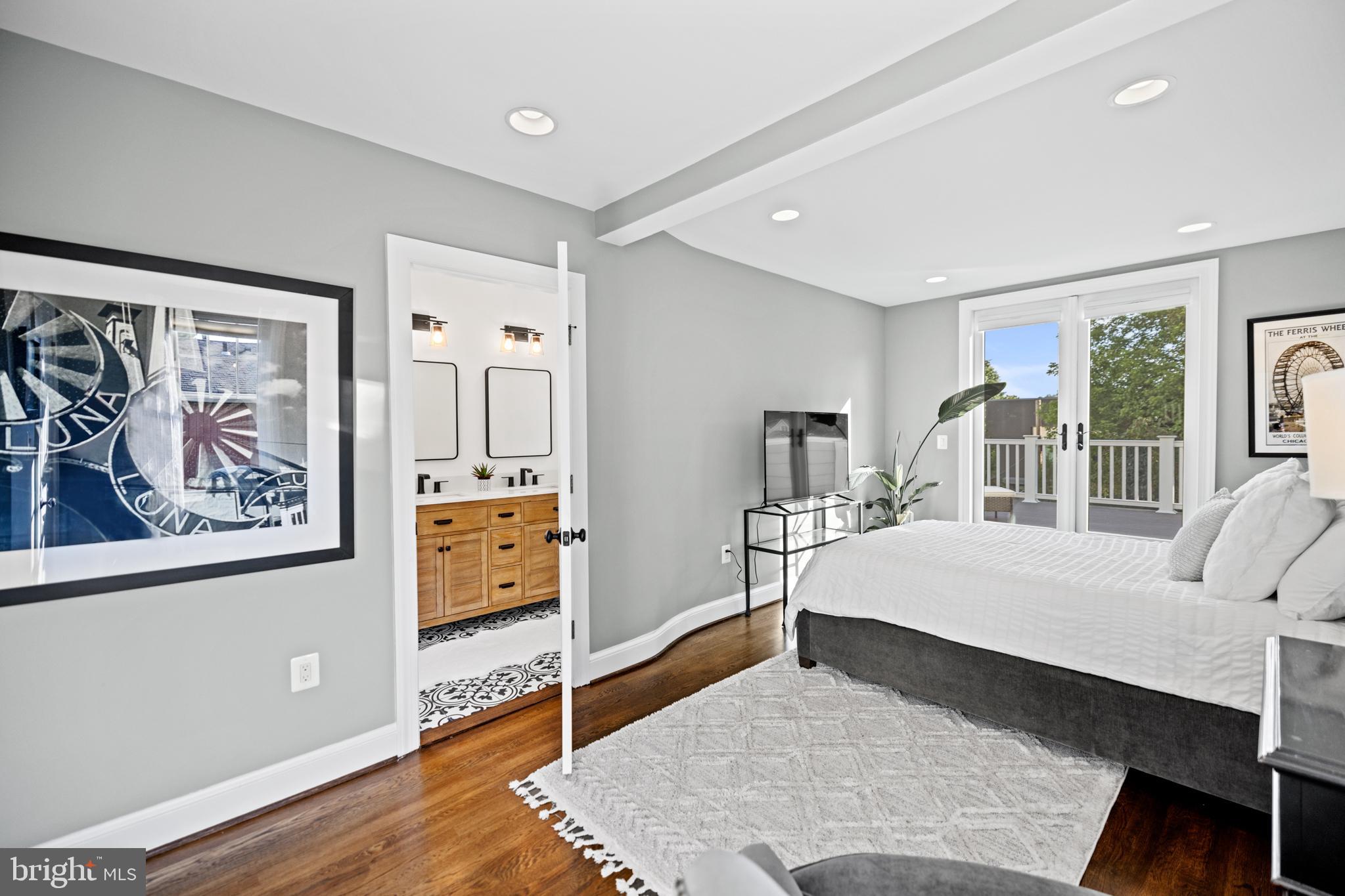 5212 MacArthur Boulevard Northwest Washington, DC 20016 - Photo 26 of 59 a living room with furniture and a flat screen tv