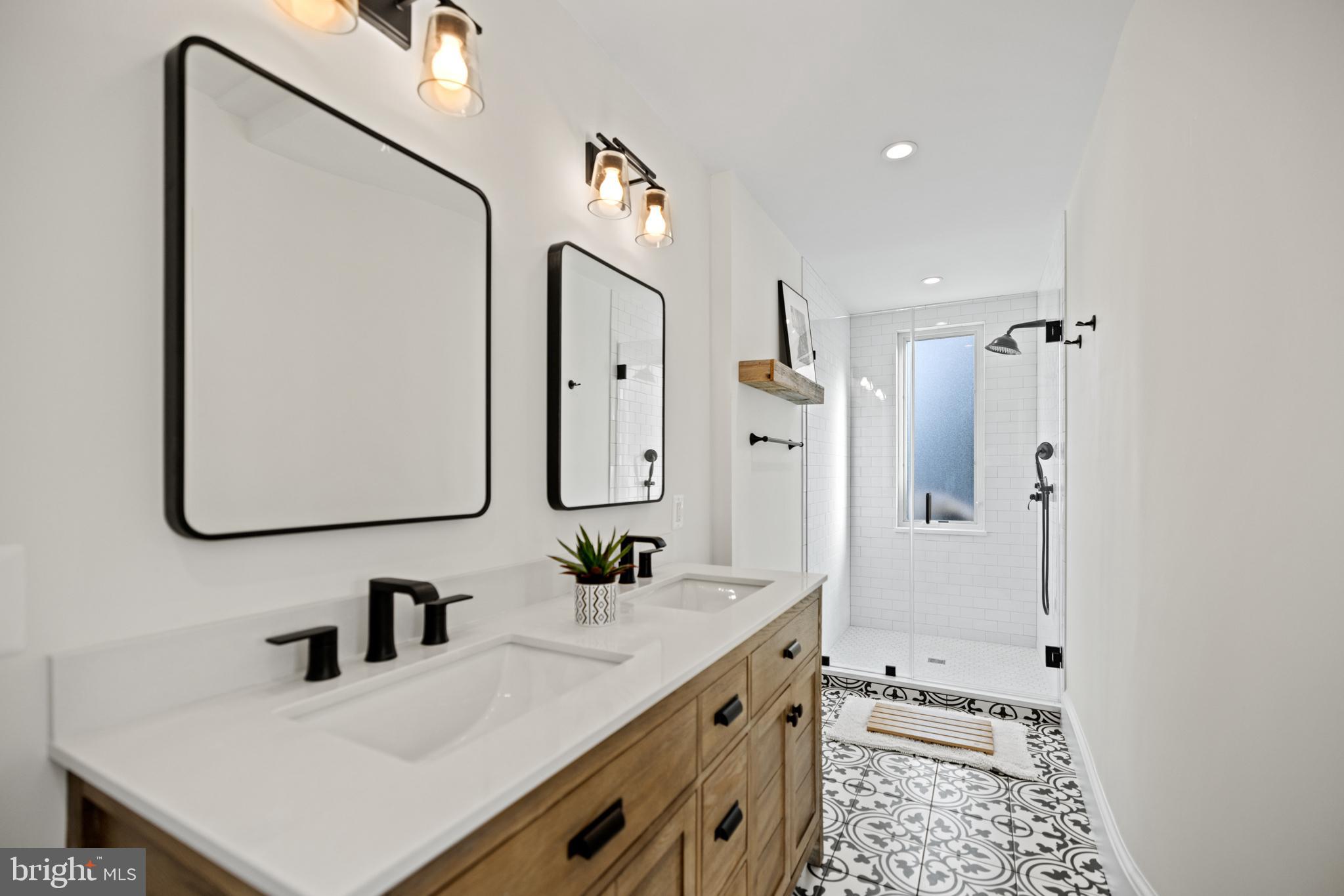 5212 MacArthur Boulevard Northwest Washington, DC 20016 - Photo 27 of 59 a bathroom with a sink and a mirror