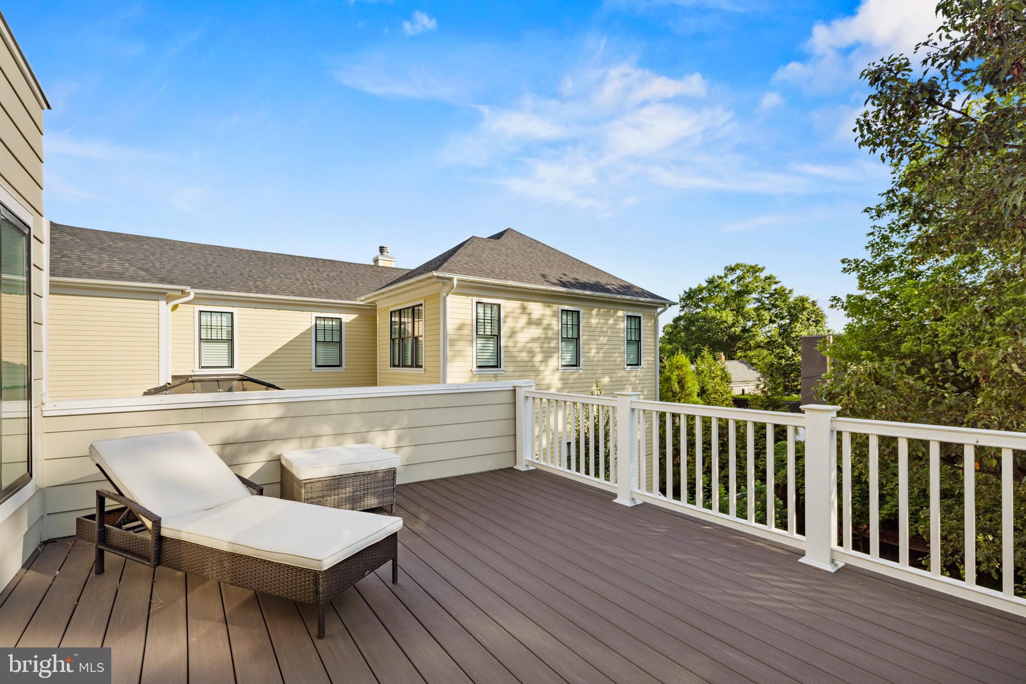 5212 MacArthur Boulevard Northwest Washington, DC 20016 - Photo 30 of 59 a view of a house with wooden deck and furniture