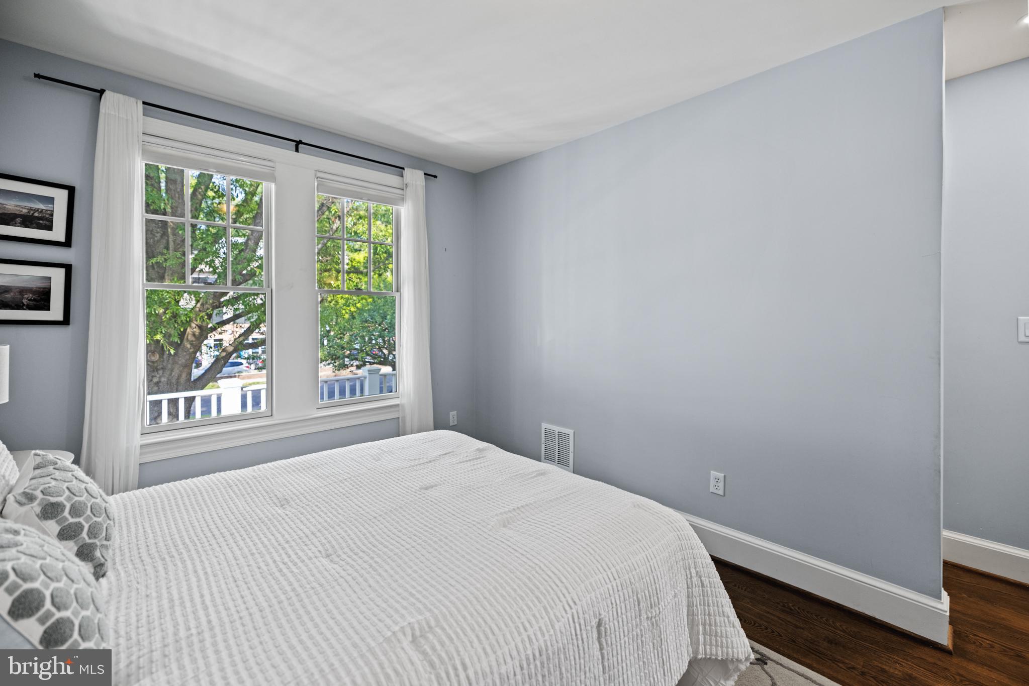 5212 MacArthur Boulevard Northwest Washington, DC 20016 - Photo 34 of 59 a bedroom with a bed and a window