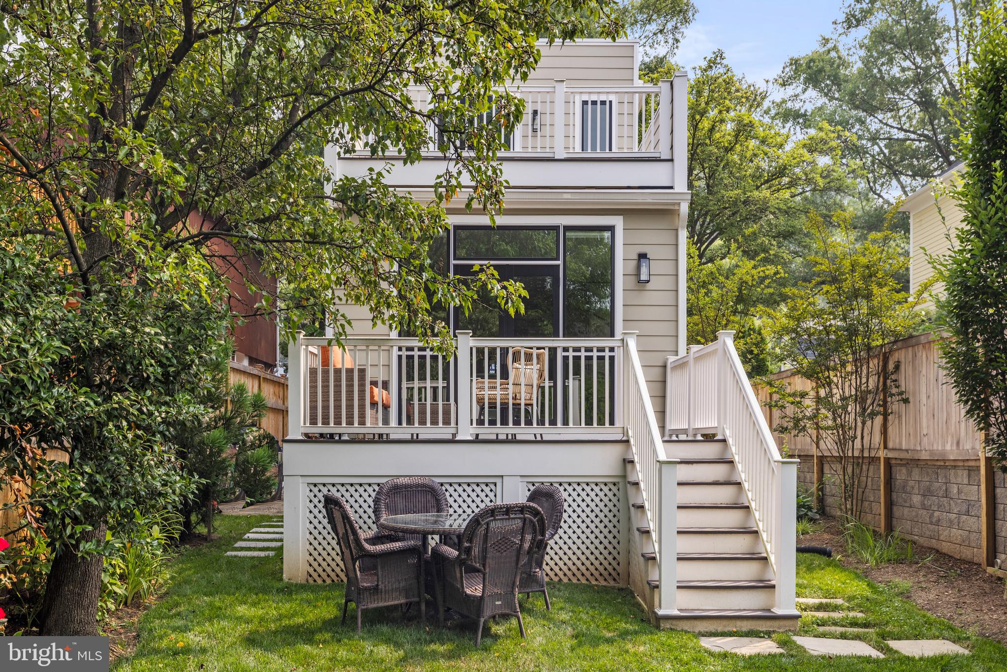 5212 MacArthur Boulevard Northwest Washington, DC 20016 - Photo 35 of 59 a view of a house with a yard and furniture