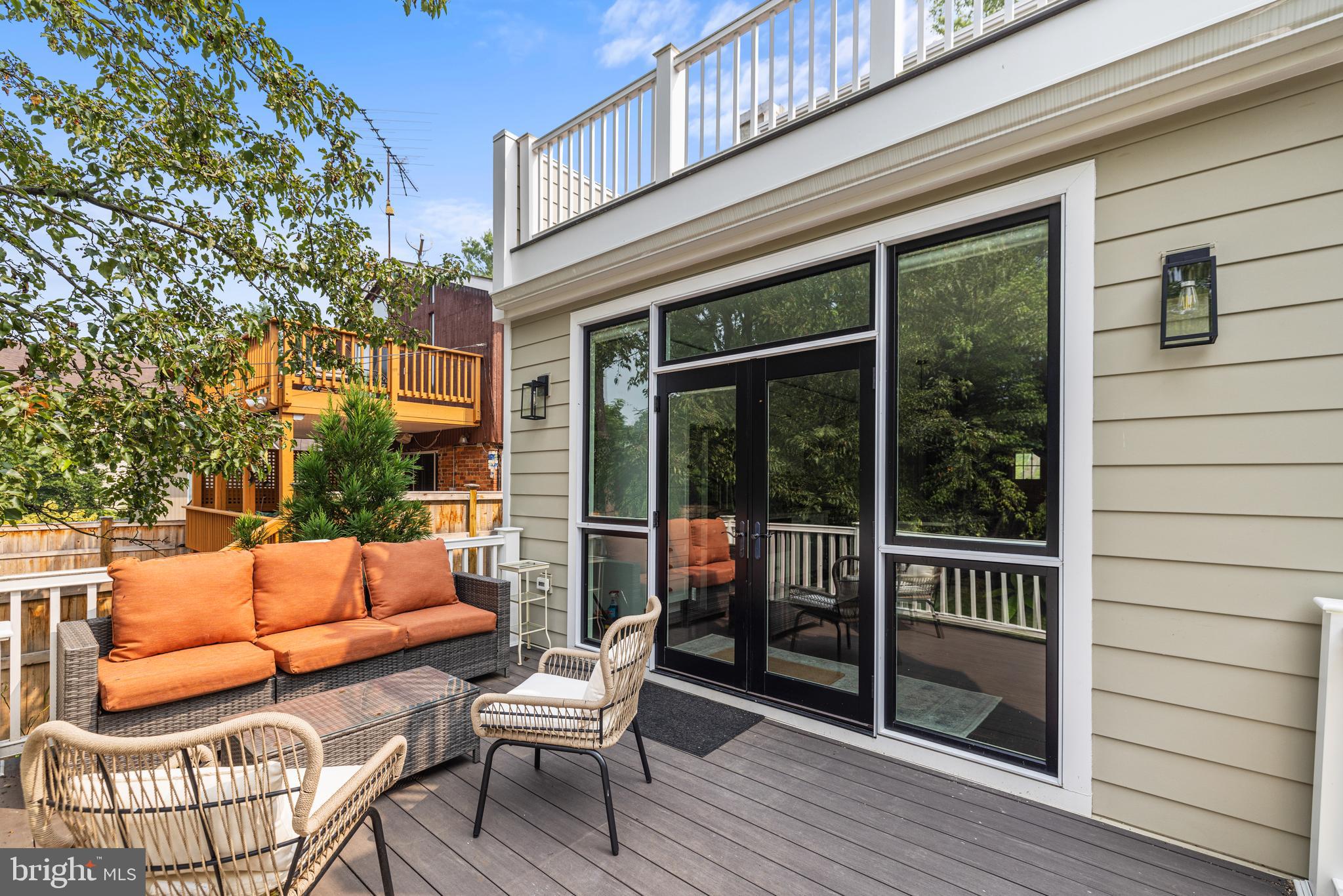 5212 MacArthur Boulevard Northwest Washington, DC 20016 - Photo 36 of 59 a outdoor living space with patio furniture and wooden floor