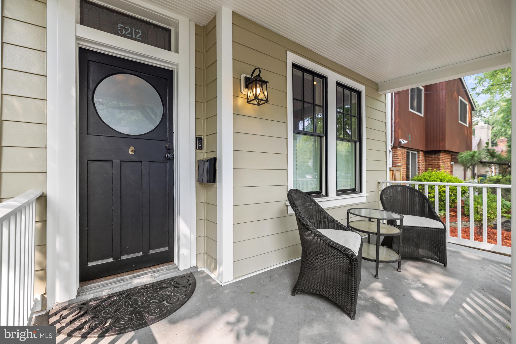 5212 MacArthur Boulevard Northwest Washington, DC 20016 - Photo 45 of 59 a living room with furniture a window and a fireplace