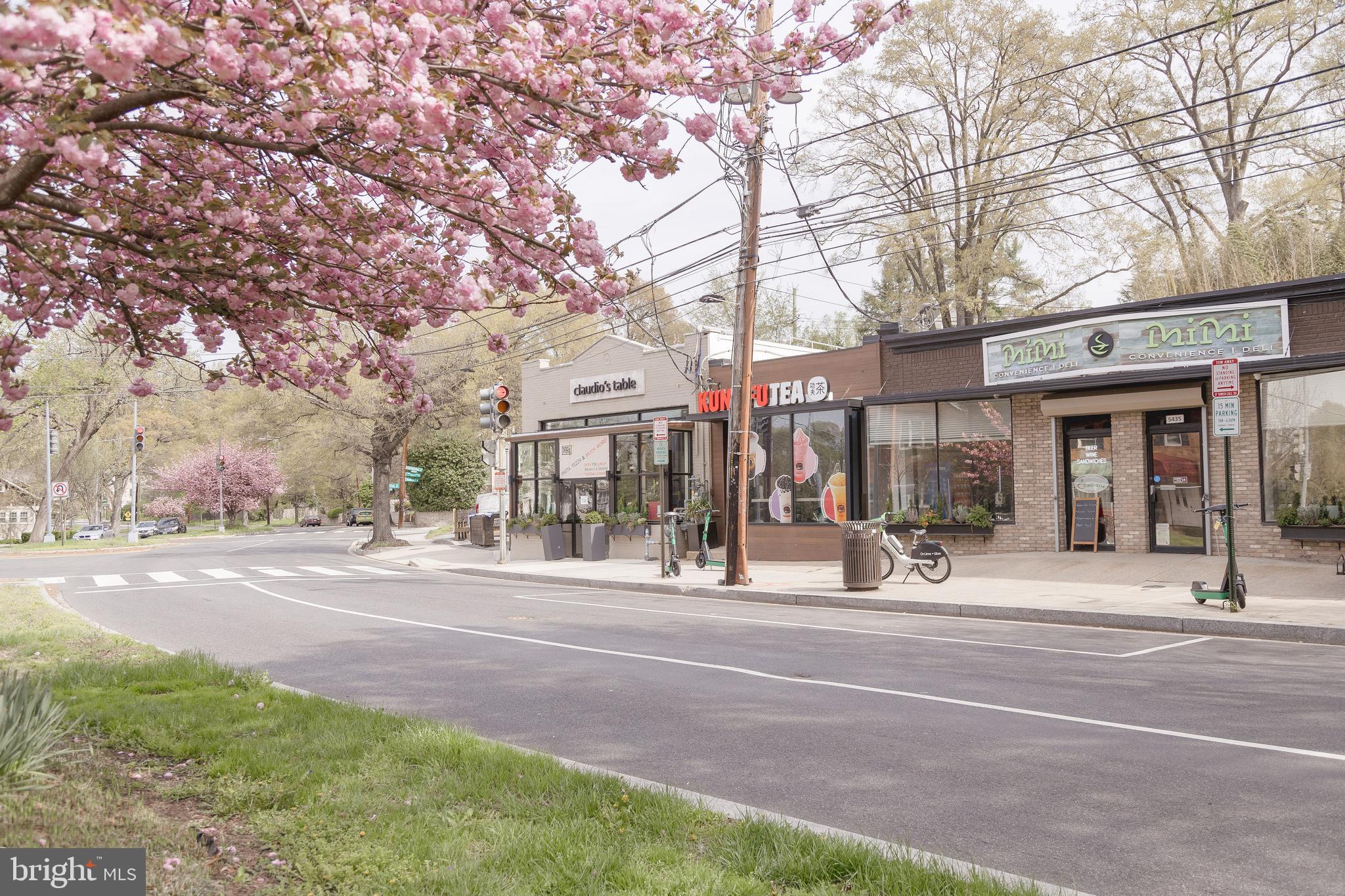 5212 MacArthur Boulevard Northwest Washington, DC 20016 - Photo 59 of 59 a view of city street with a building and trees in the background